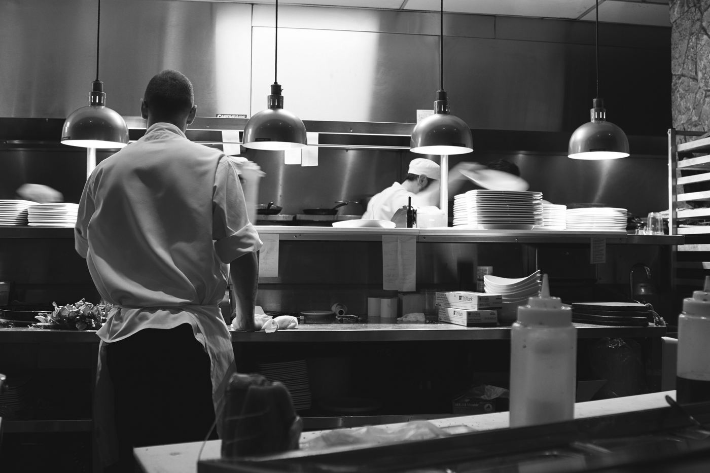 Chefs working in a professional restaurant kitchen